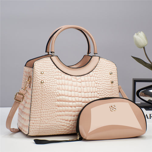 Blush croc-embossed top-handle handbag with matching zip pouch