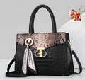 Black croc-embossed tote with metallic snakeskin-print flap and scarf charm