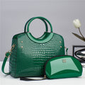 Green croc-embossed top-handle handbag with matching zip pouch