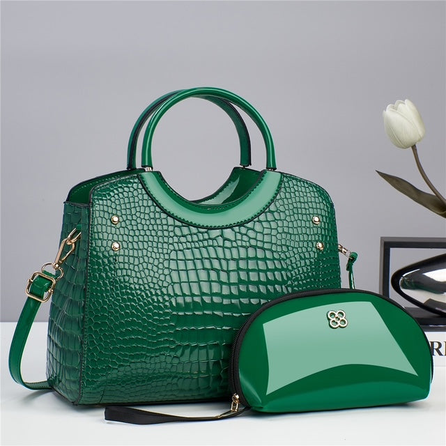 Green croc-embossed top-handle handbag with matching zip pouch
