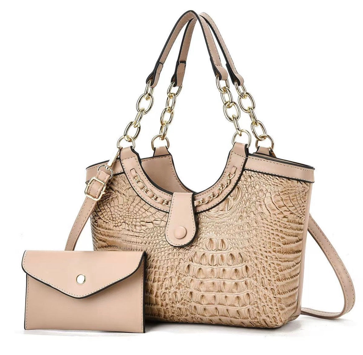 Beige crocodile-style handbag with gold-tone chain-link handles and shoulder strap, pictured beside a beige envelope pouch