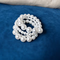 Graduated Pearl Stretch Bracelet Set on blue velvet background