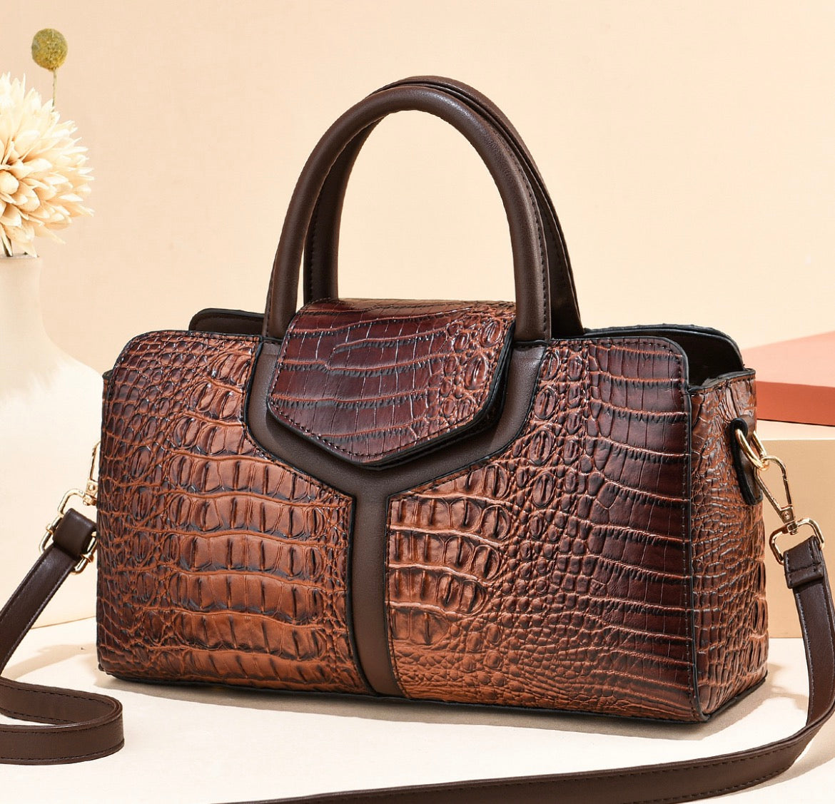 Brown crocodile-style textured satchel handbag with dark brown twin handles, smooth trim, and shoulder strap