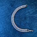 Blue Sapphire Crystal Tennis Bracelet on blue velvet background
