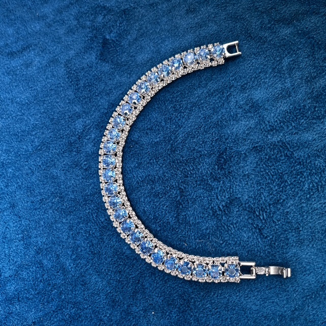 Blue Sapphire Crystal Tennis Bracelet on blue velvet background