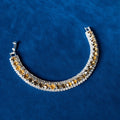 Amber Crystal Tennis Bracelet on blue velvet background