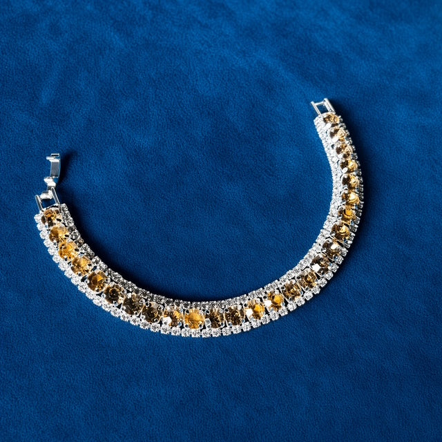 Amber Crystal Tennis Bracelet on blue velvet background