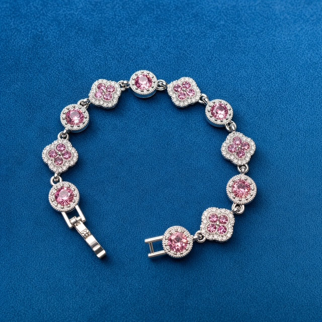 Pink Clover Crystal Bracelet on blue velvet background