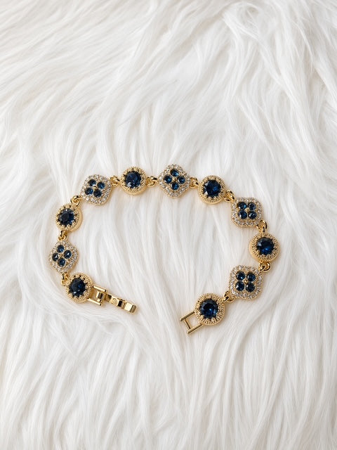 Navy Blue Clover Crystal Bracelet on white fur background