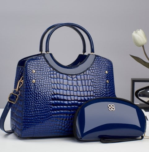 Navy croc-embossed top-handle handbag with matching zip pouch