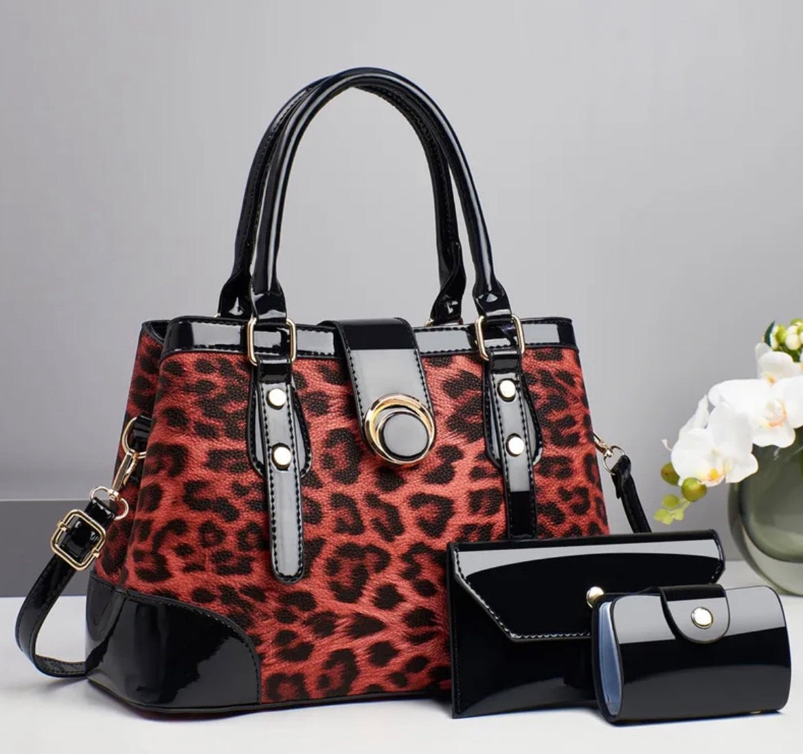 Leopard print top-handle handbag with matching black wallet and card case